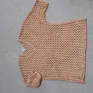 Crocheted sweater with a gold metallic thread in a peach color